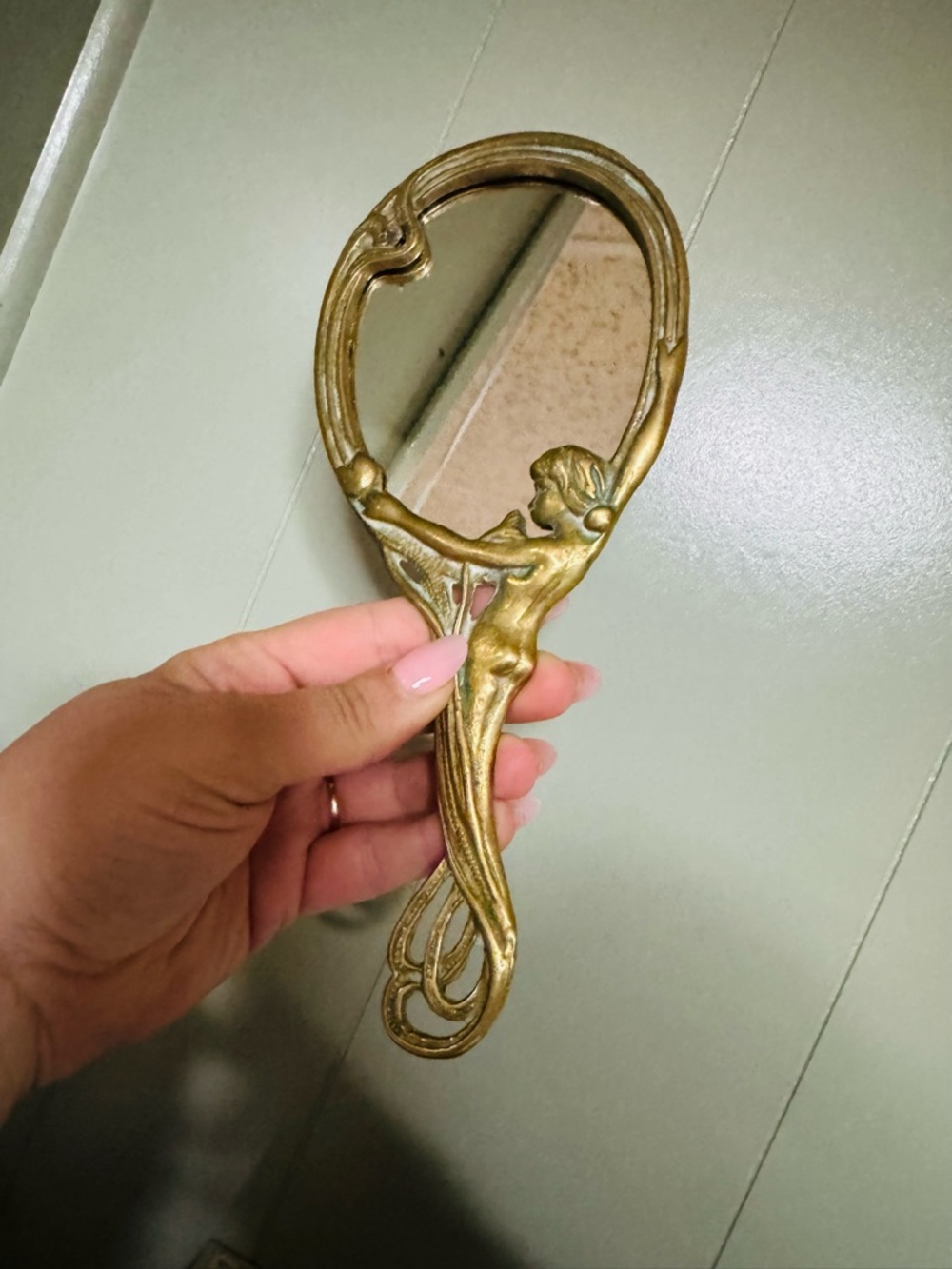 Vintage hand-held vanity brass mirror
